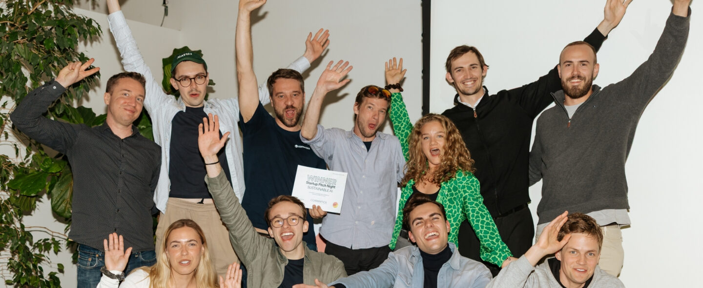 group of eleven people cheering on the winner